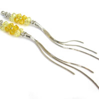 Długie srebrne kolczyki wężyki z kryształkami w kolorze żółtym Swarovski